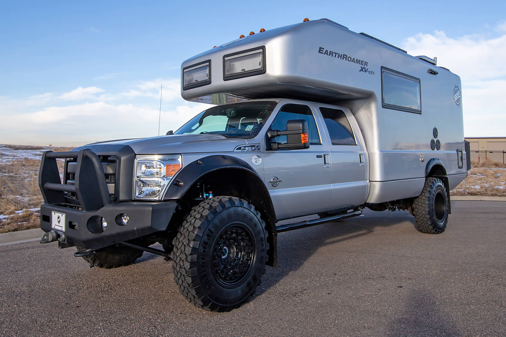 EarthRoamer XV-LTS off-road expedition vehicle parked outdoors showcasing rugged build and adventure-ready design.