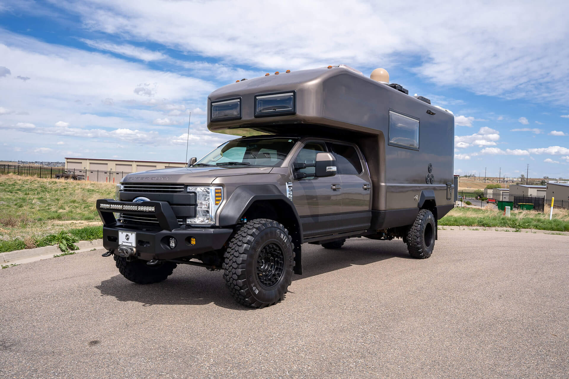 EarthRoamer XV-LTS off-road vehicle shown in action on rugged outdoor terrain.